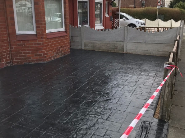 New classic grey concrete driveway in Stretford
