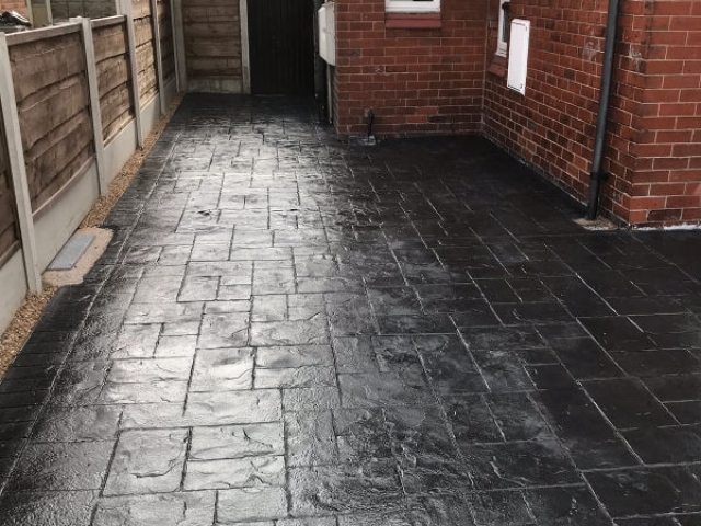 New classic grey concrete driveway in Stretford