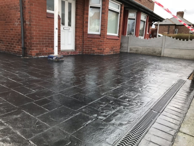 New classic grey concrete driveway in Stretford