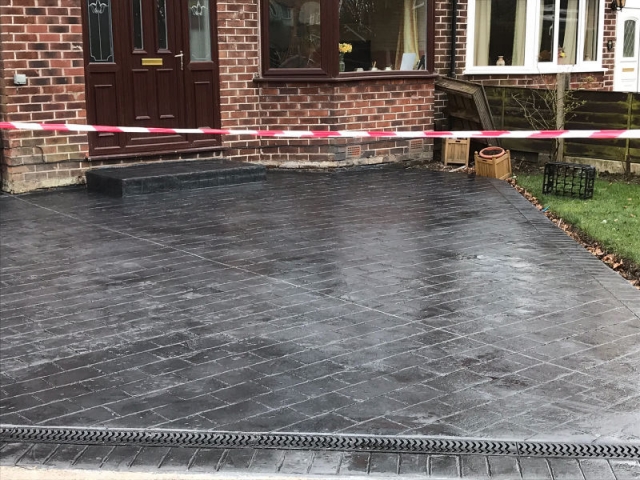 New classic grey concrete driveway in Urmston