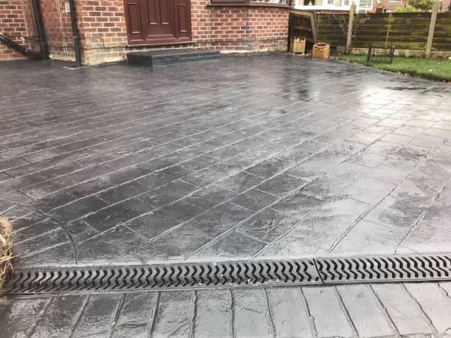 New classic grey concrete driveway in Urmston