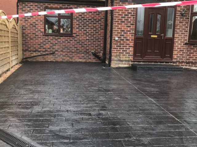 New classic grey concrete driveway in Urmston