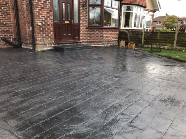 New classic grey concrete driveway in Urmston